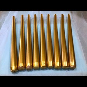 Amscan nine (9) gold taper candles. Twelve inches tall, used once. Not burned!